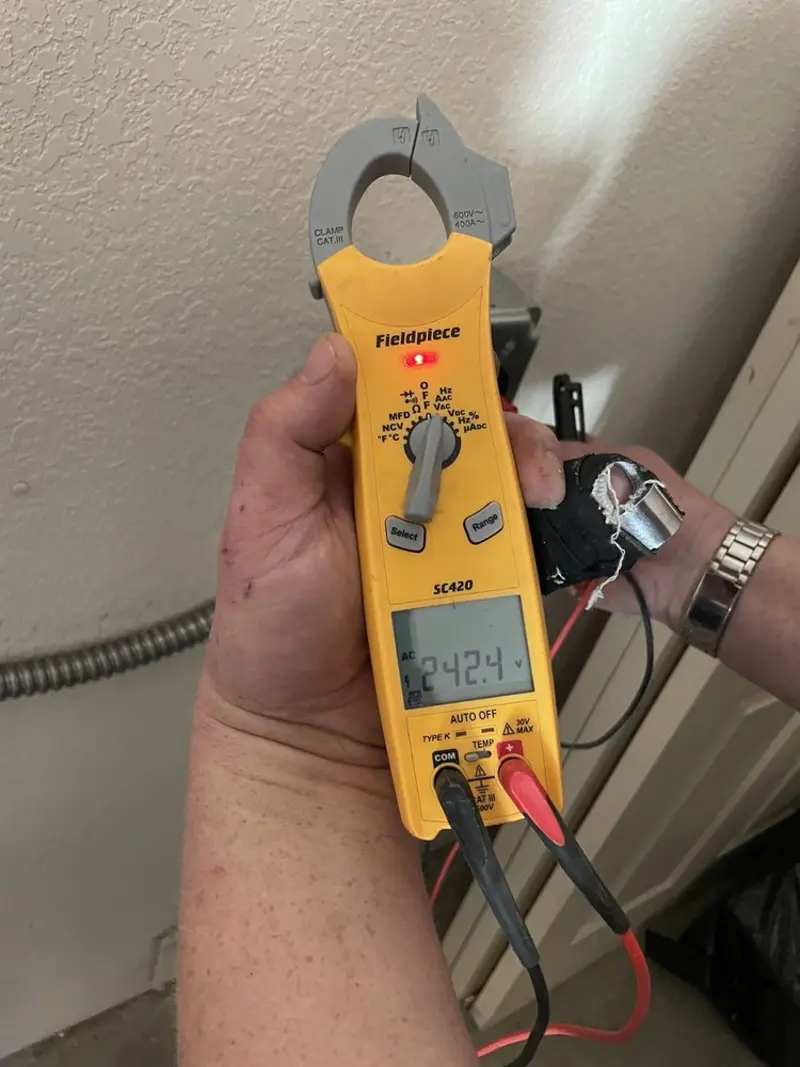 Voltage testing with clamp meter during Generator Installation in East Lansing